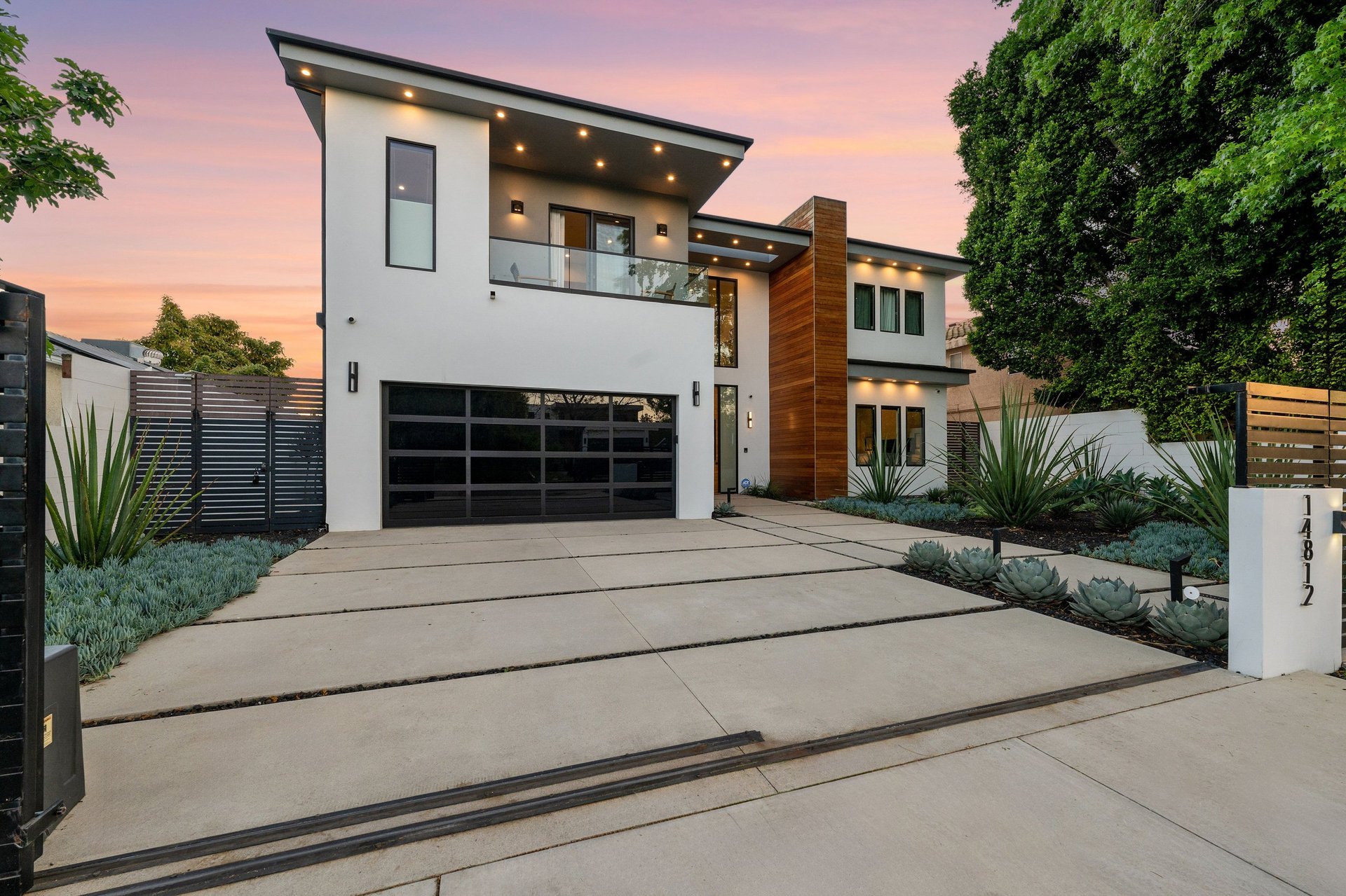 Modern luxury home exterior with pool and patio