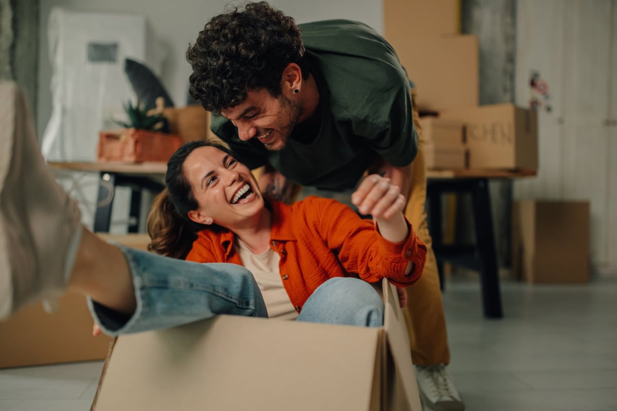 Happy couple moving in